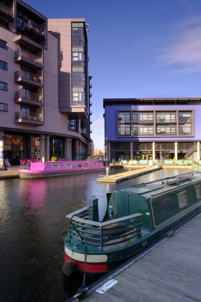 Scotland, Edinburgh, Union Canal. Canal Boats moored in the Lochrin Basin on the Union Canal near Fountainbridge. Now known as the Edinburgh Quay, the site has seen recent redevelopment and a number of bars and apartments are situated along the quayside.