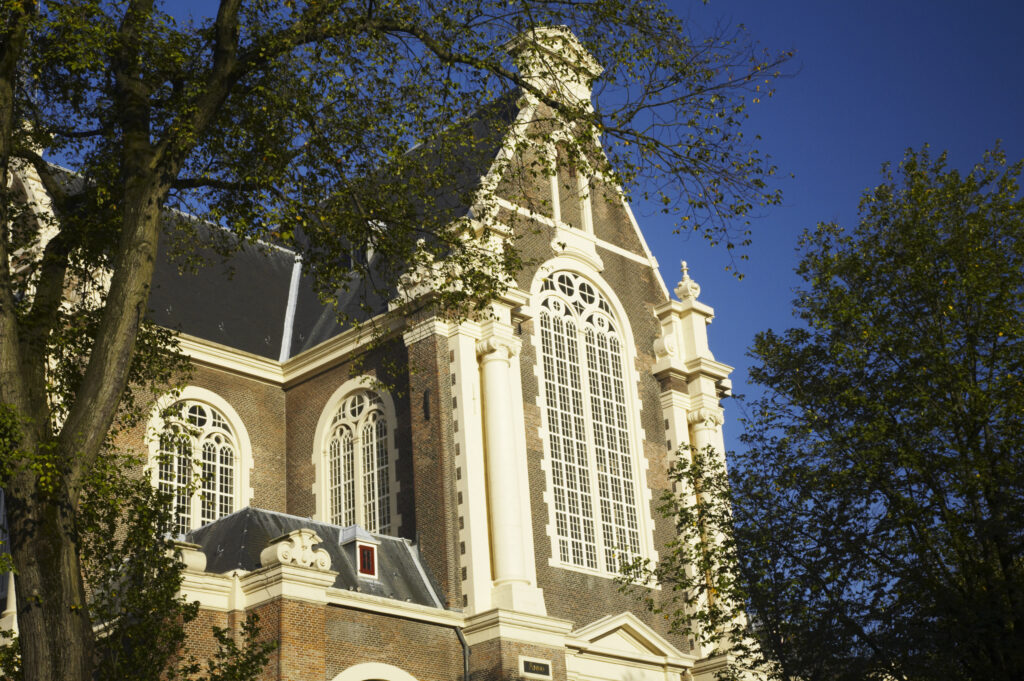 Netherlands, North Holland, Amsterdam. Morning light accentuates the impressive architecture of the Westerkerk buiding in Amsterdam City.