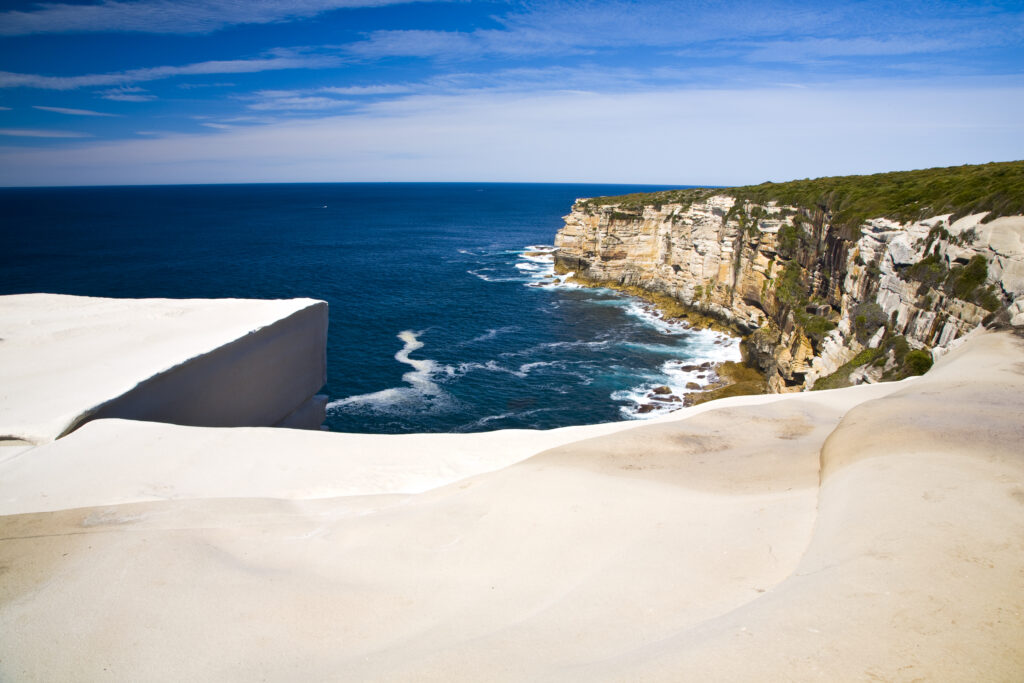 Australia, New South Wales, Royal National Park. Sandstone cliifs overlooking the Pacific Ocean viewed from the Royal National Park Coastal Track.