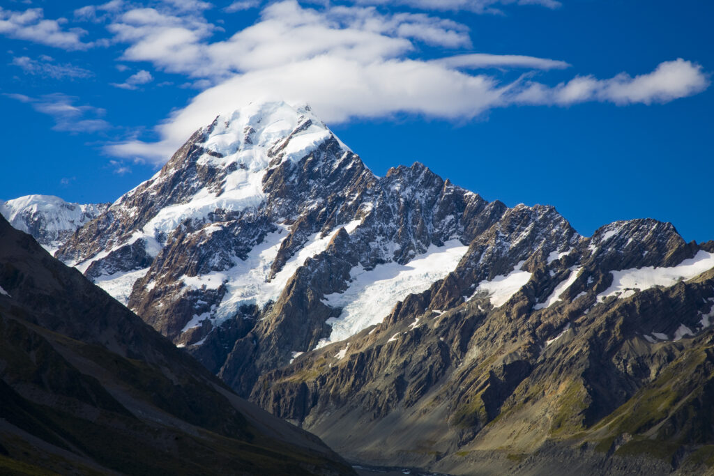 New Zealand, Canterbury, Mt Cook National Park. Storm clouds hug the peak of the mighty Mt Cook (known to the Maori as Aoraki) the highest peak in Australasia at 3755M.