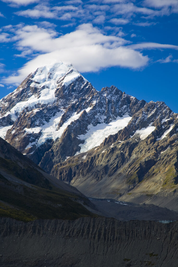 New Zealand, Canterbury, Mt Cook National Park. Storm clouds hug the peak of the mighty Mt Cook (known to the Maori as Aoraki) the highest peak in Australasia at 3755M.