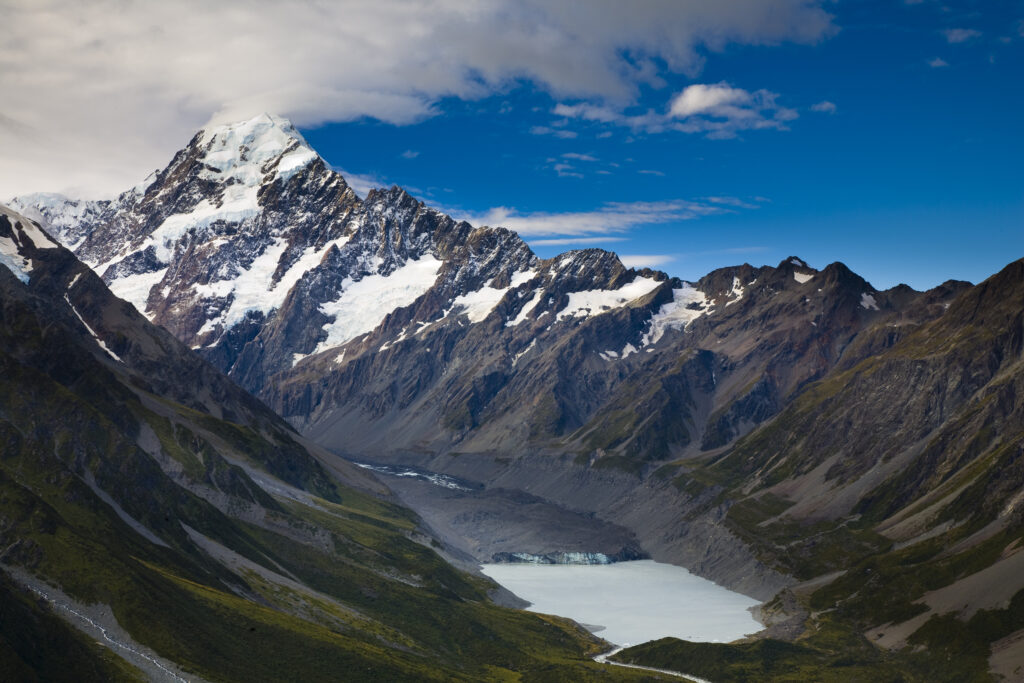 New Zealand, Canterbury, Mt Cook National Park. Storm clouds hug the peak of the mighty Mt Cook (known to the Maori as Aoraki) above the Hooker Glacier