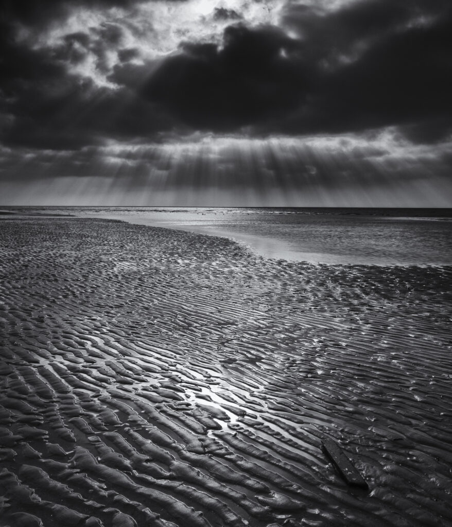 England, Lancashire, Blackpool. Dramaic light above the Irish Sea along the South Shore at Blackpool.