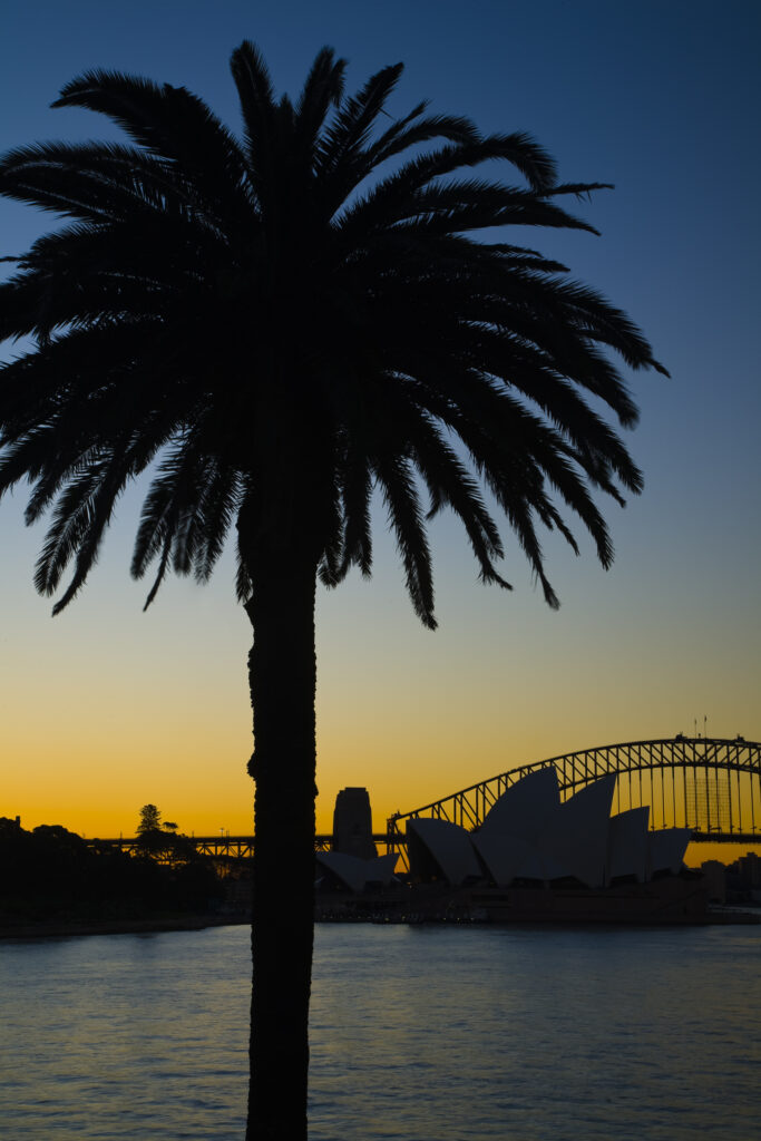 Australia, New South Wales, Sydney. Sydney Harbour bridge and the opera house viewed at sunset.