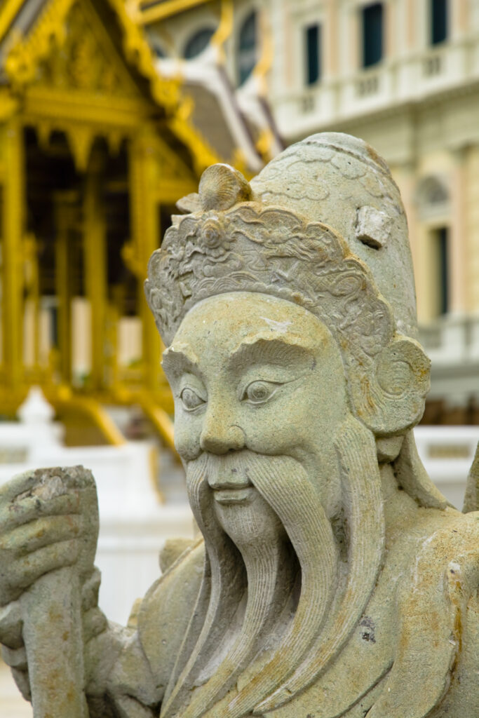 Thailand, Bangkok, The Grand Palace. Statue in the grand setting of the golden grand palace.