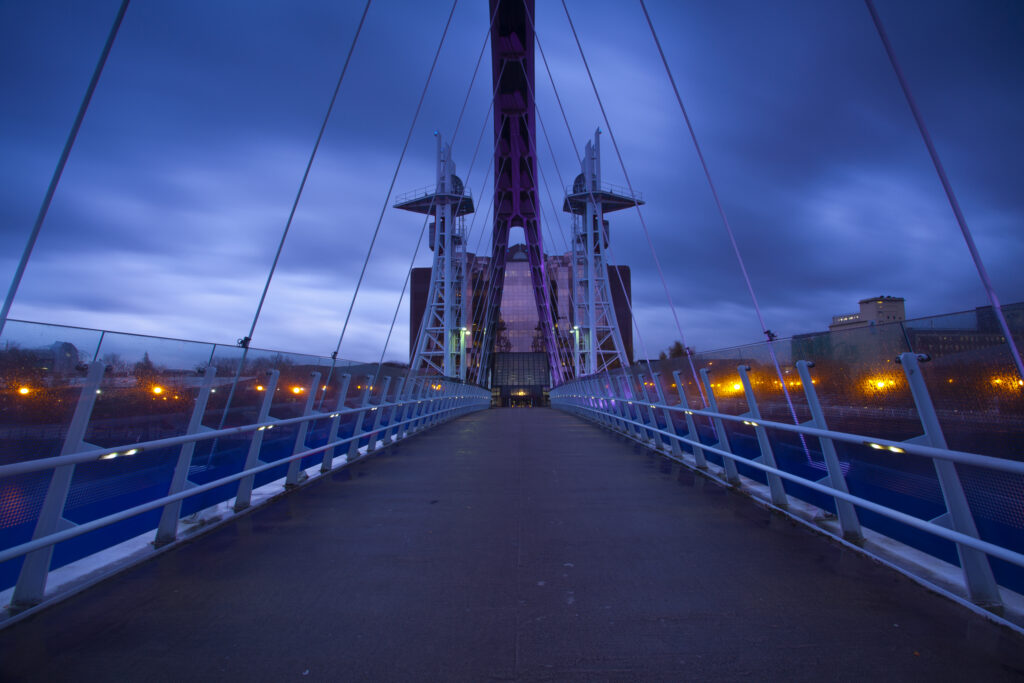 England, Greater Manchester, Salford Quays. The Lowry Bridge at dusk, located on the Salford Quays in the city of Salford near Manchester Old Trafford.
