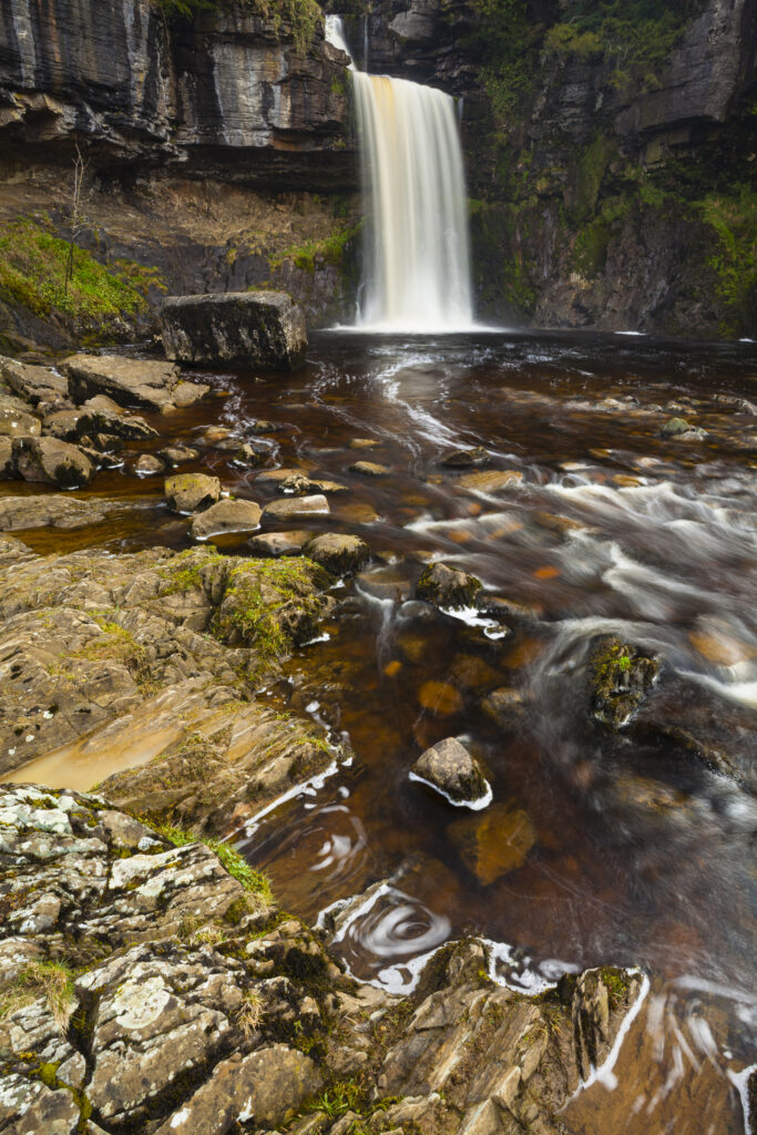 England, North Yorkshire, Ingleton. The fast flowing waters of the Thornton Force waterfall near Ingleton near the Yorkshire Dales National Park.