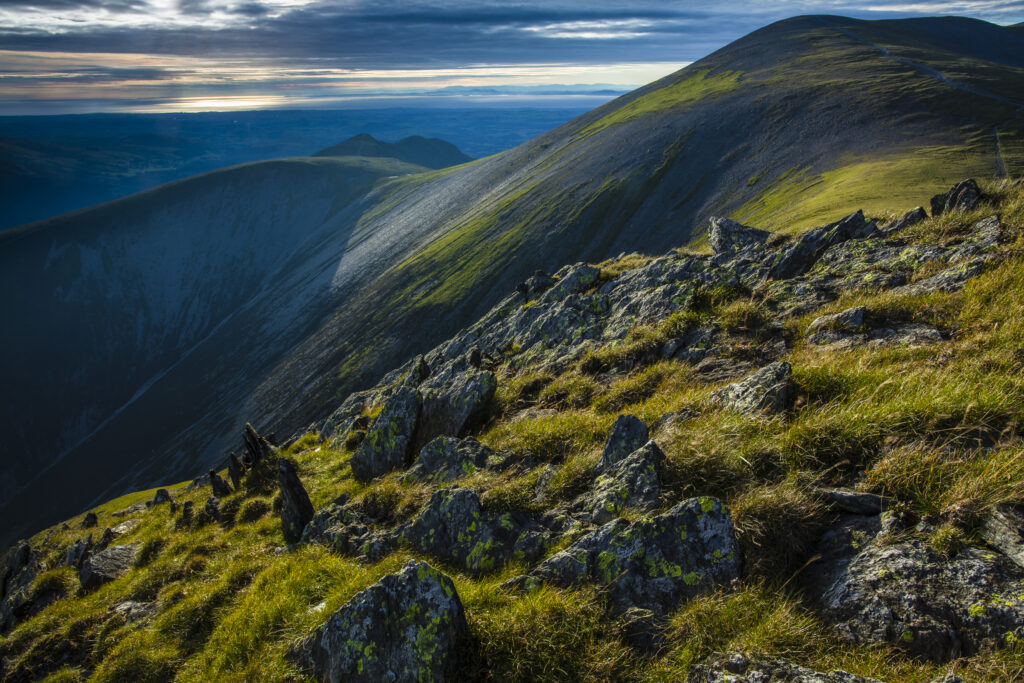 England, Cumbria, Lake District National Park. The Solway Firth viewed from the summit of the Skiddaw mountain near Keswick.