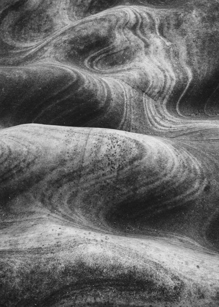 England, North Yorkshire, Scarborough. Wave sculptured rocks on the coast near Scarborough in the North York Moors National Park.