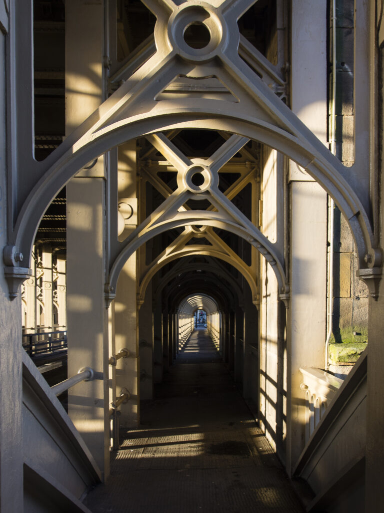 England, Tyne and Wear, Newcastle Upon Tyne. The High Level Bridge, a wrought iron tied arch (bow-string girder) bridge which crosses the River Tyne, designed by Robert Stephenson and built between 1847 and 1849.