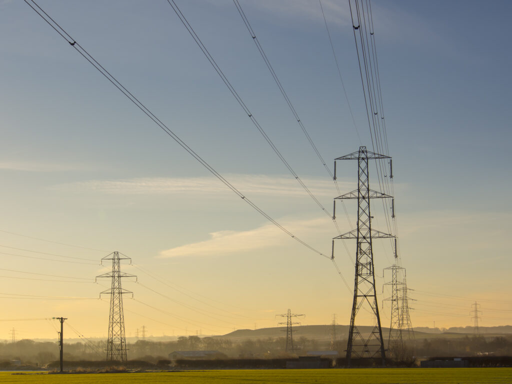 England, Northumberland, Seaton Delaval. Electricity Pylons carrying electricity through Southern Northumberland.