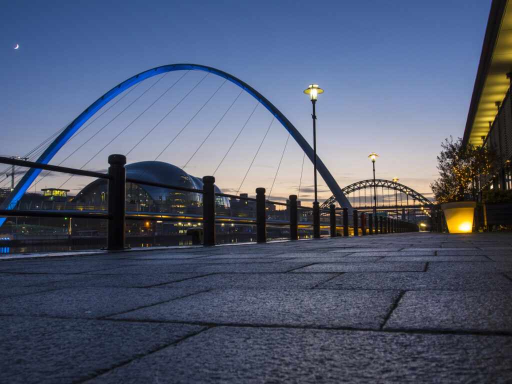 England, Tyne and Wear, Newcastle Upon Tyne. The Gateshead Millennium Bridge, Tyne Bridge and Sage Building located alongside the River Tyne and Newcastle / Gatehead Quayside.