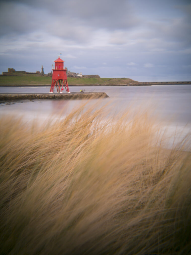 England, Tyne & Wear, South Shields. Little Haven Beach, looking towards the South Groyne Lighthouse.