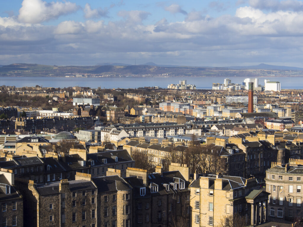 Scotland, Edinburgh, Calton Hill. Looking across Edinburgh City New Town to The Firth of Forth.