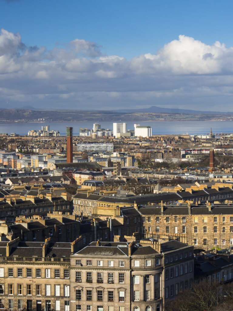 Scotland, Edinburgh, Calton Hill. Looking across Edinburgh City New Town to The Firth of Forth.