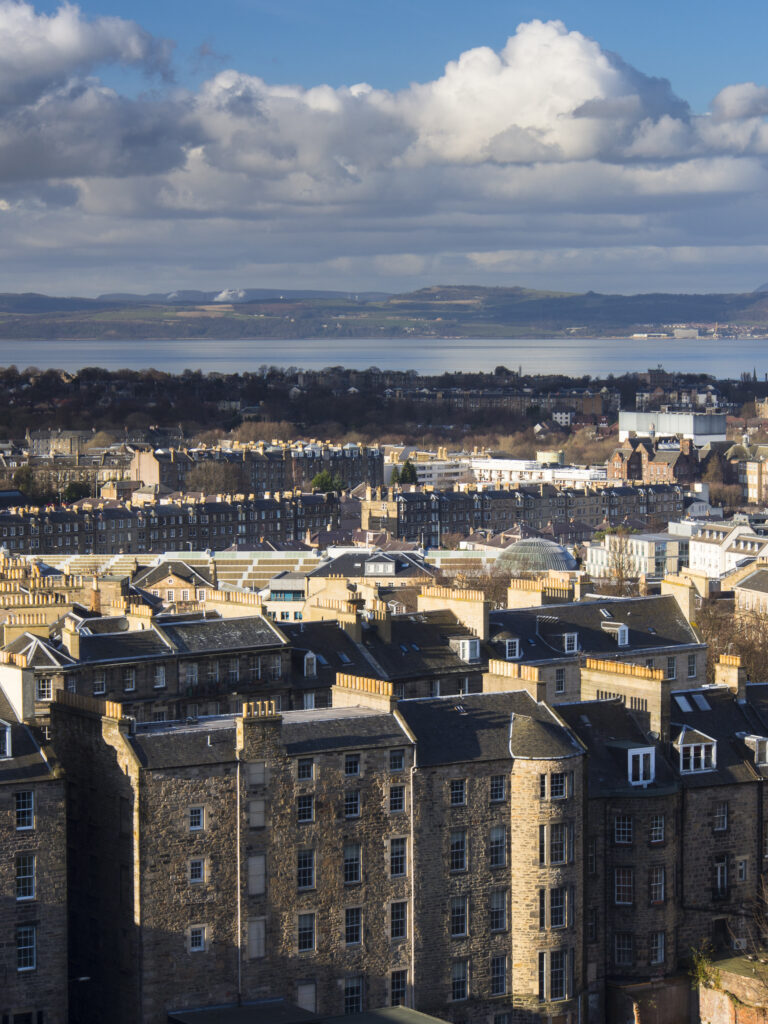 Scotland, Edinburgh, Calton Hill. Looking across Edinburgh City New Town to The Firth of Forth.