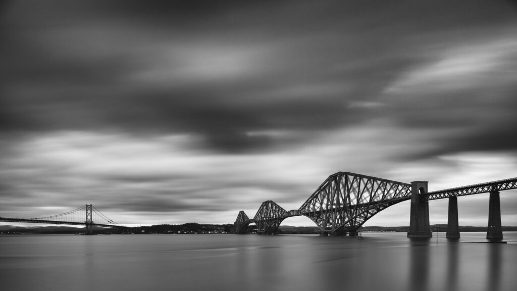 Scotland, Edinburgh, Forth Bridge. Forth Railway Bridge & Forth Road Bridge connecting Scotland's capital city, Edinburgh, with Fife, leaving the Lothians at Dalmeny and arriving in Fife at North Queensferry.