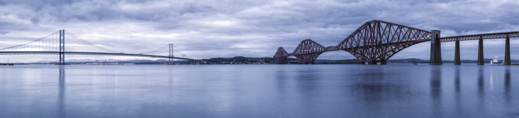 Scotland, Edinburgh, Forth Bridge. Forth Railway Bridge & Forth Road Bridge connecting Scotland's capital city, Edinburgh, with Fife, leaving the Lothians at Dalmeny and arriving in Fife at North Queensferry.