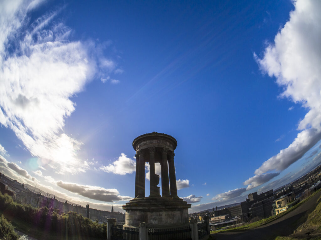 Scotland, Edinburgh, Calton Hill. The Dugald Stewart Monument on Calton Hill, looking towards the Castle and Old Town of Edinburgh.