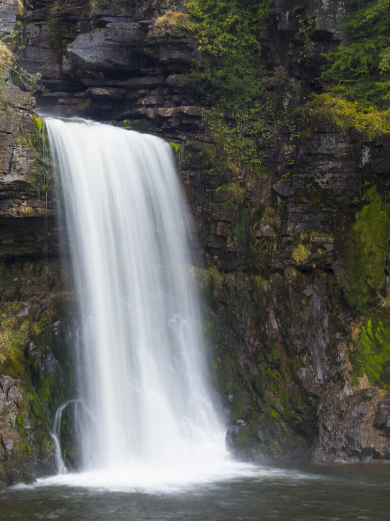 England, North Yorkshire, Yorkshire Dales National Park. The fast flowing waters of the Thornton Force waterfall, near Ingleton.