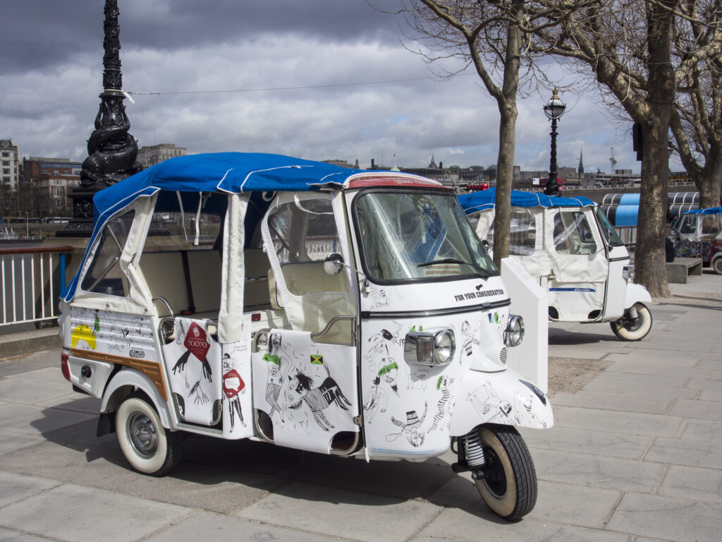 England, London, South Bank. Iconic Rickshaws outside the Royal Festival Hall part of the Southbank Centre located on the River Thames.