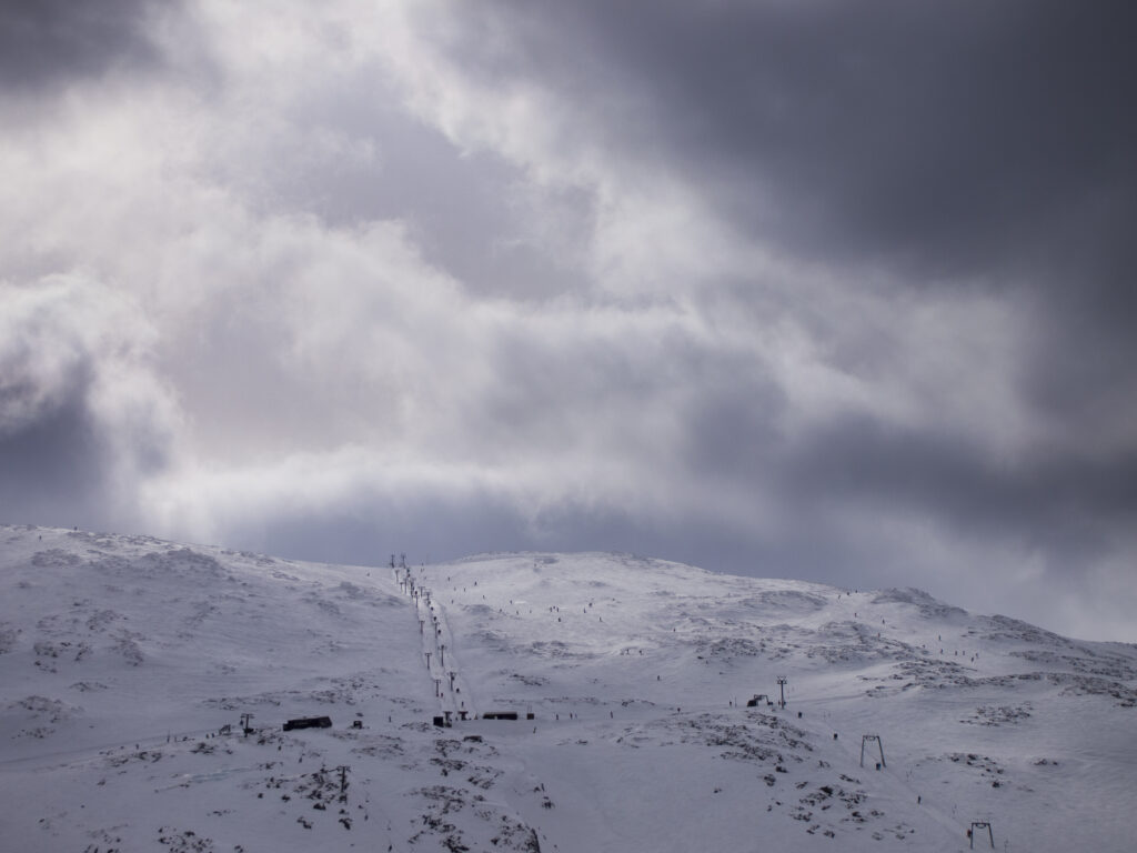 Scotland, Scottish Highlands, Glencoe. Storm clouds above the Glencoe Mountain Resort - A popular skiing and snowboarding ski field in the West Highlands.