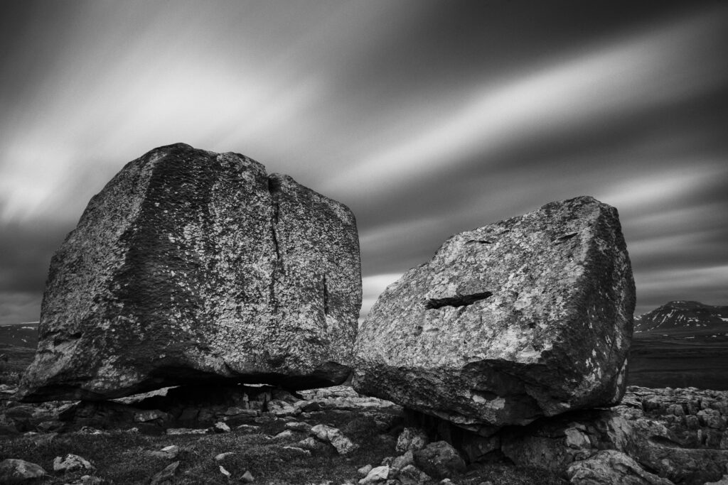 England, North Yorkshire, Yorkshire Dales National Park. The Cheese Press stones, above Kingsdale, with Ingleborough in the distance.