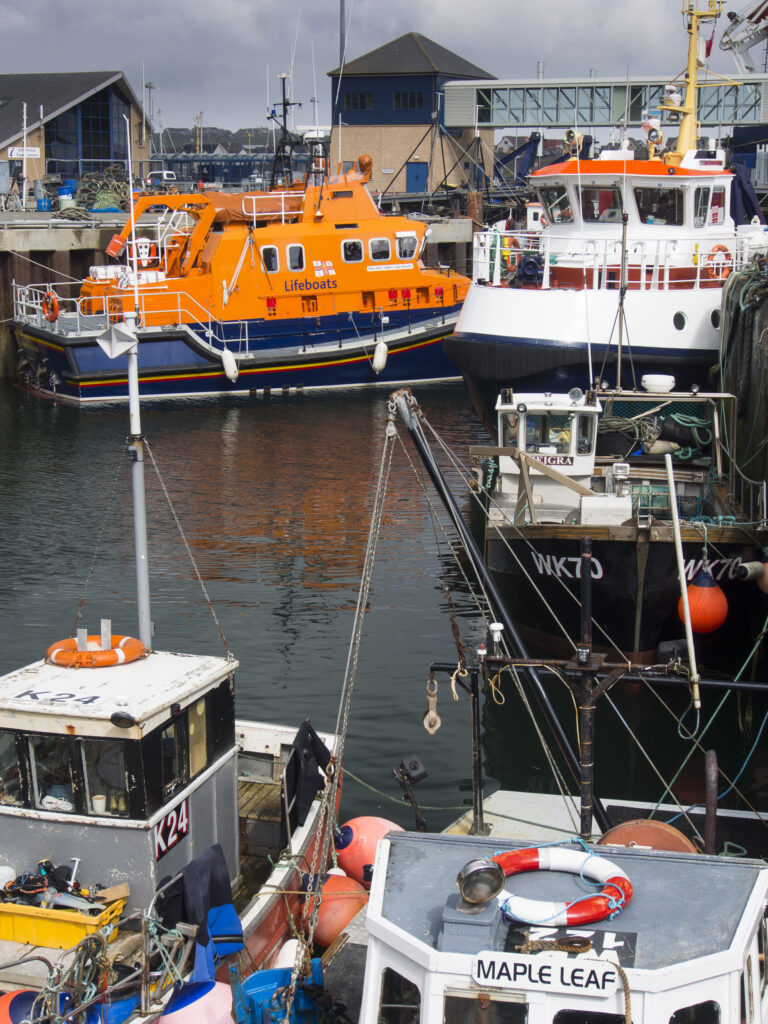 Scotland, Orkney Islands, Mainland Orkney. A variety of sea boats moored in Stromness Harbour on mainland Orkney.