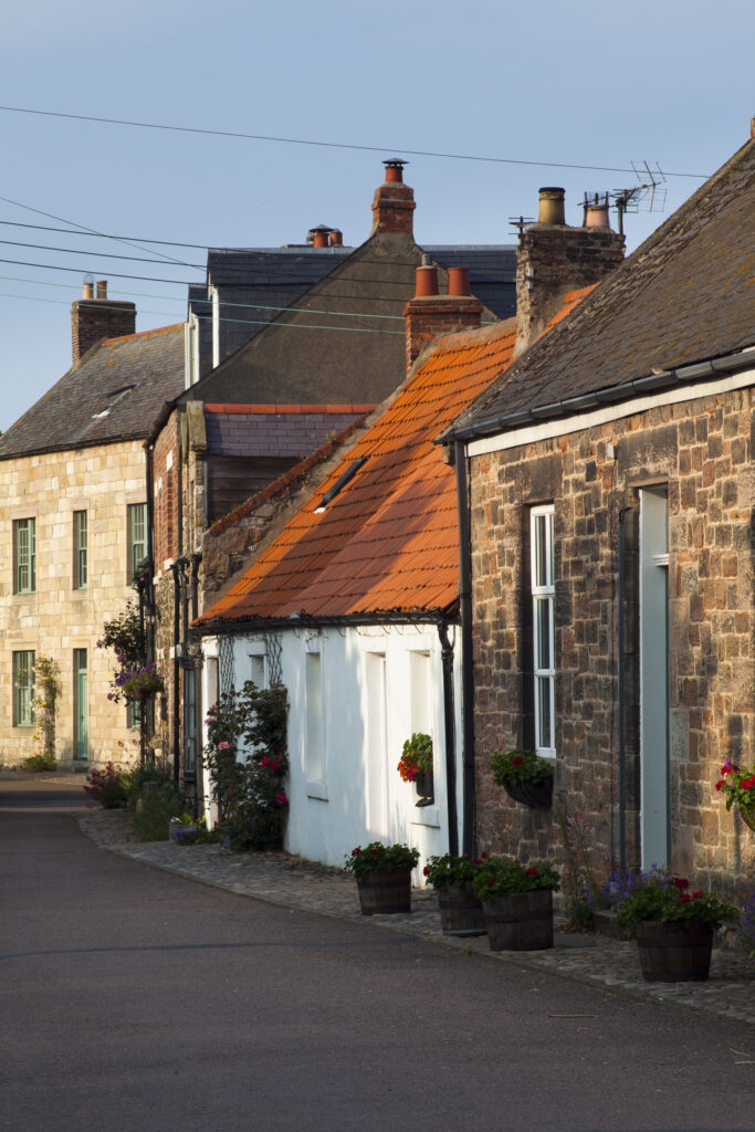England, Northumberland, Lindisfarne / Holy Island. Traditional buildings along a village street on Lindisfarne