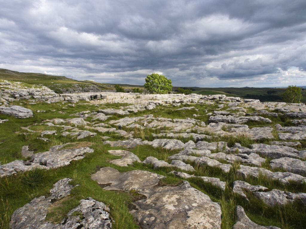 England, Yorkshire, Yorkshire Dales National Park. The impressive natural rock formations / geology of limestone paving above Malham Cove in the Yorkshire Dales National Park, in Yorkshire.