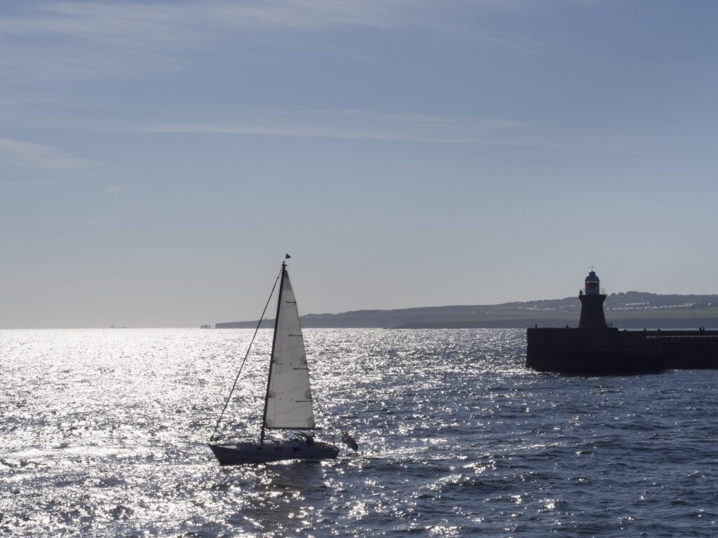 Portal Editing Team selected this image for Photodisc -- England, Tyne and Wear, Tynemouth. Sailing boat near the leaving the mouth of the River Tyne.