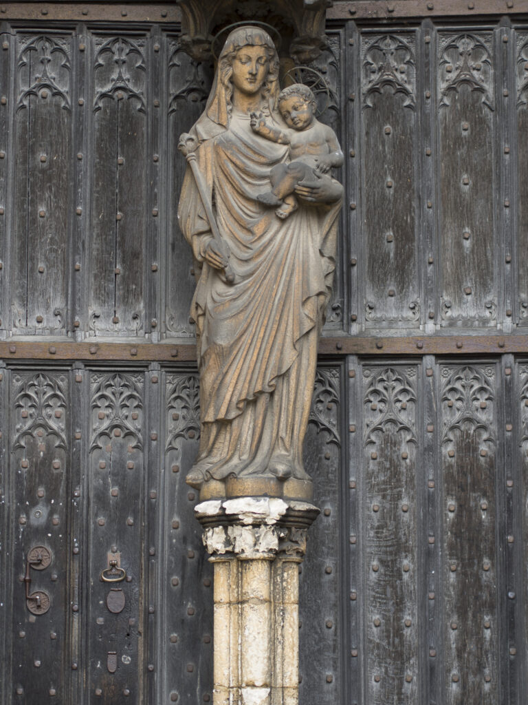 England, Lincolnshire, Lincoln Cathedral. Ornate statue of Mary and Jesus located at a doorway to Lincoln Cathedral in the city of Lincoln.