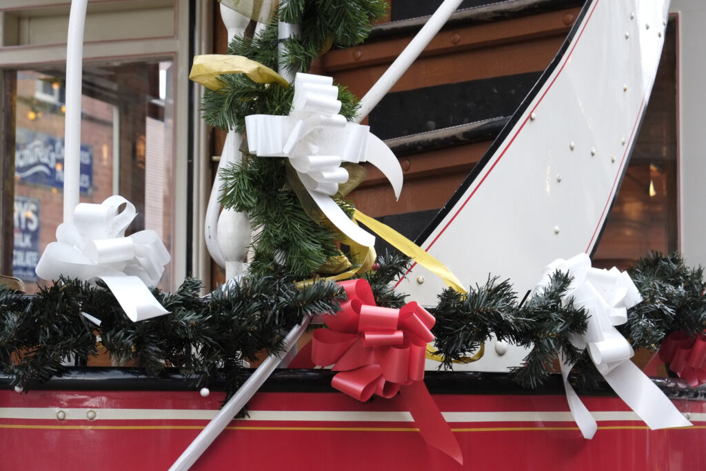 England, Tyne & Wear, Beamish Museum. Christmas decoraions on a tram at the Beamish Museum, a world famous museum telling the story of the people of North East England during the Georgian, Victorian, and Edwardian periods.