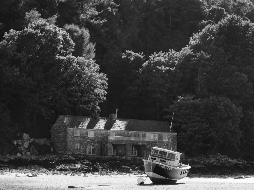 Wales, LLeyn Peninsula, Traeth Llanbedrog. Boat moored at low tide on Llanbedrog Beach on the LLeyn Peninsula.
