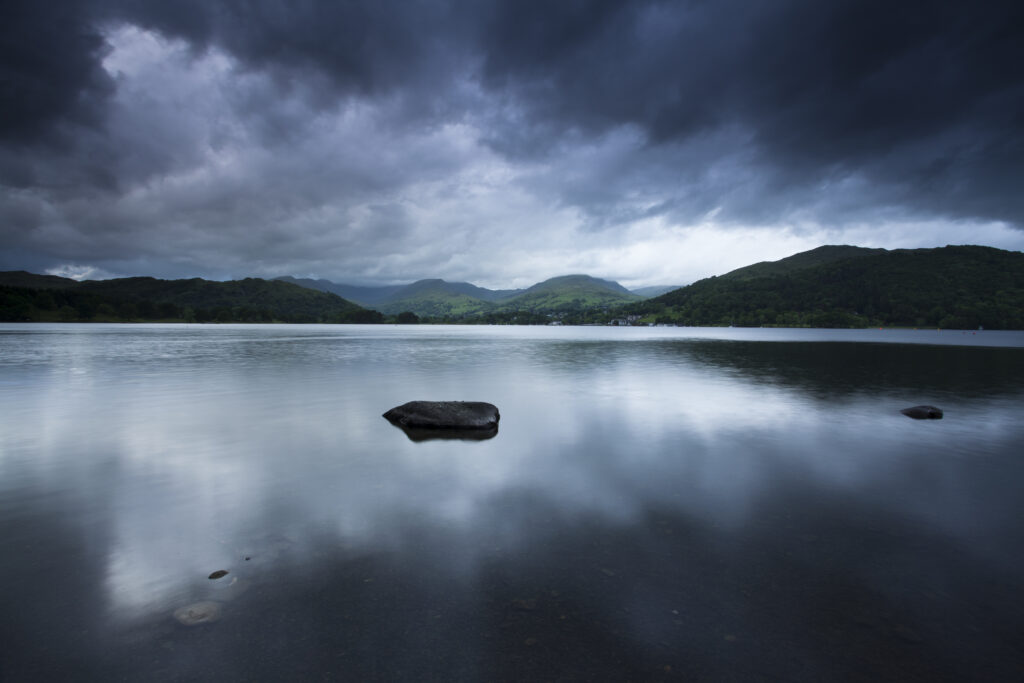 England, Cumbria, Lake District National Park. Dusk on Lake Windermere, viewed from Low Wray looking towards Ambleside.