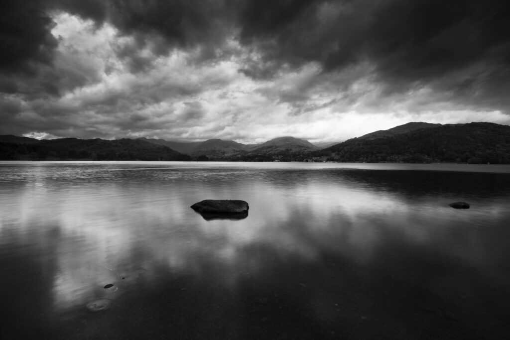 England, Cumbria, Lake District National Park. Dusk on Lake Windermere, viewed from Low Wray looking towards Ambleside.