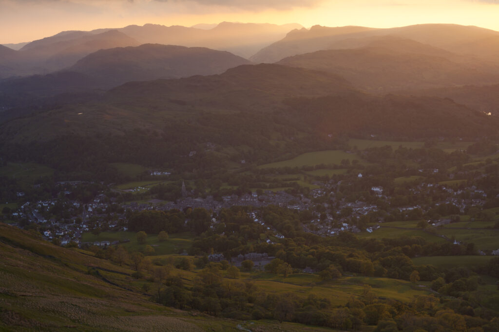 England, Cumbria, Lake District National Park. Last light over Ambleside viewed from Wansfell Pike.