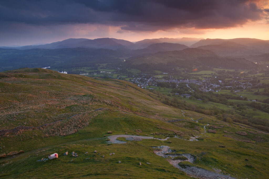 England, Cumbria, Lake District National Park. Last light over Ambleside viewed from Wansfell Pike.