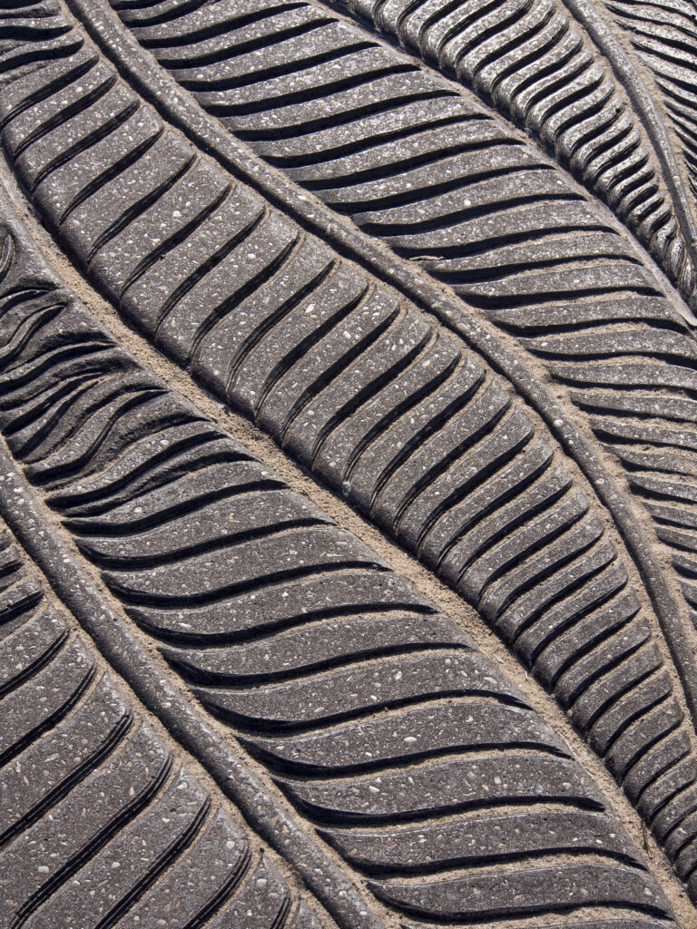 England, Lancashire, Morecambe. Patterns on the concrete pavement promenade along the sea front at Morecambe / Morecambe Bay.