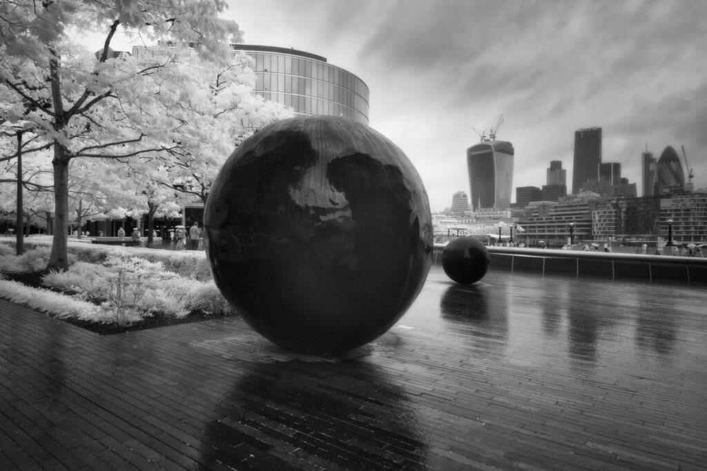 England, London, Southwark. A wet day near London City Hall, 'The Scoop' amphitheatre and the 'More London' business and retail develpoment with the London Financial District in the distance.
