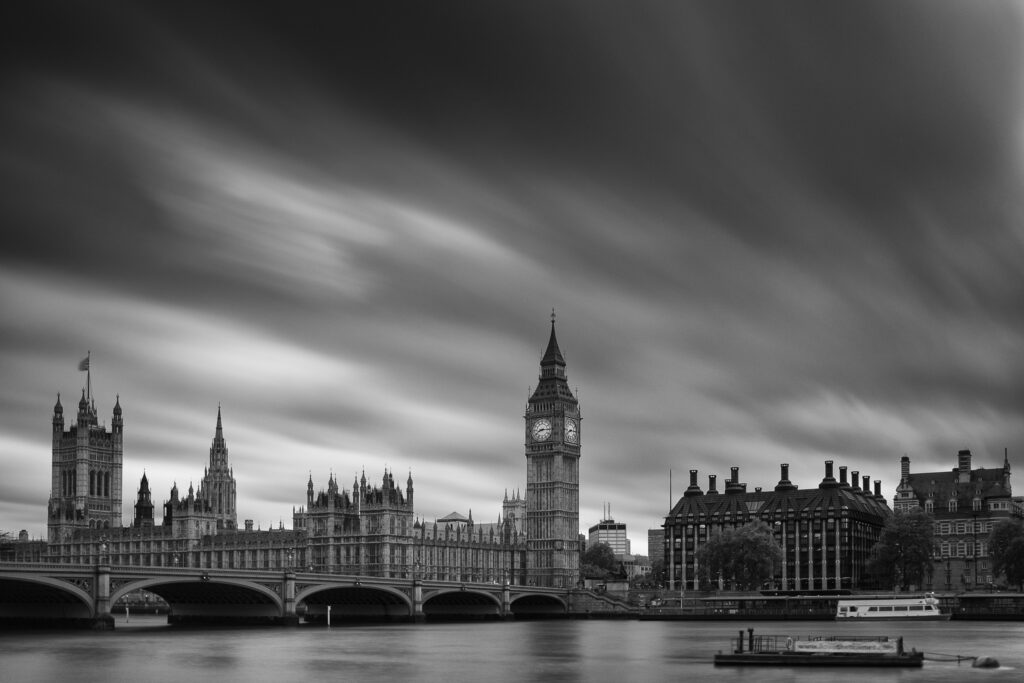 England, Greater London, City of Westminster. Storm clouds pass above the iconic Big Ben also known as the Clock Tower, and the Houses of Parliament building (also known as the Palace of Westminster), located in the City of Westminster, London.