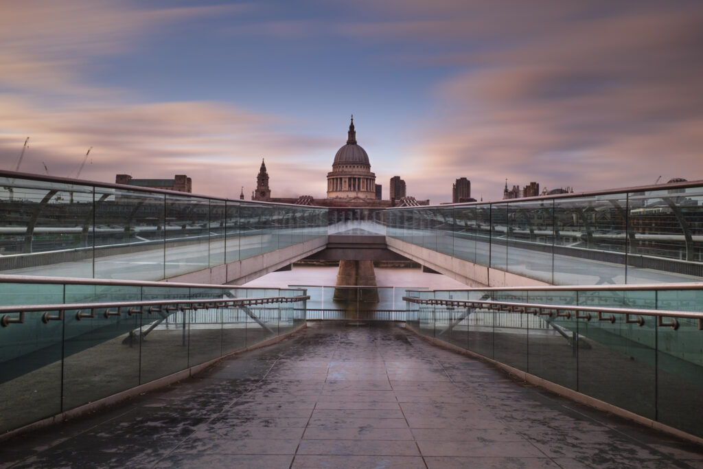 England, Greater London, London City. The London Millennium Footbridge crossing the River Thames with St Paul's Cathedral in the distance.