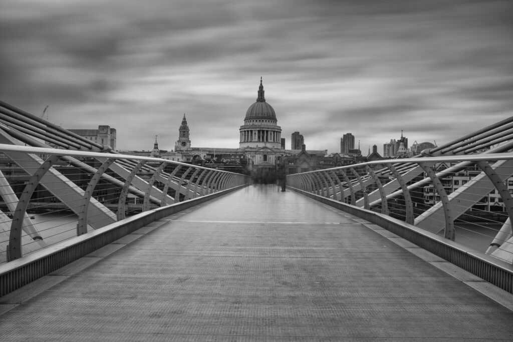 England, Greater London, London City. The London Millennium Footbridge crossing the River Thames with St Paul's Cathedral in the distance.