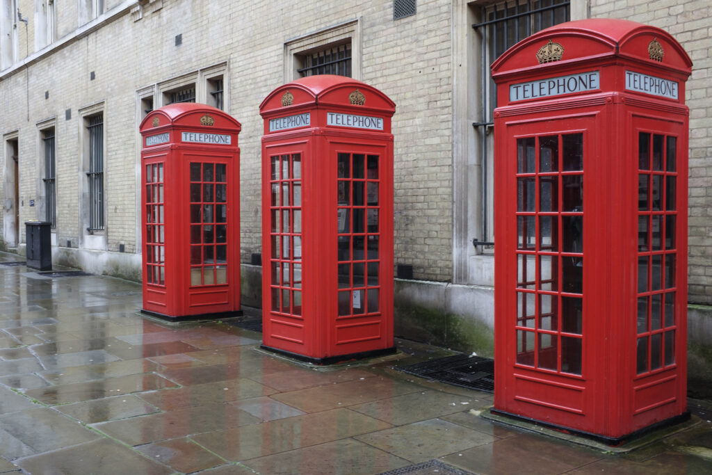 England, Greater London, Covent Garden. Traditional red public telephone box located near Covent Garden.