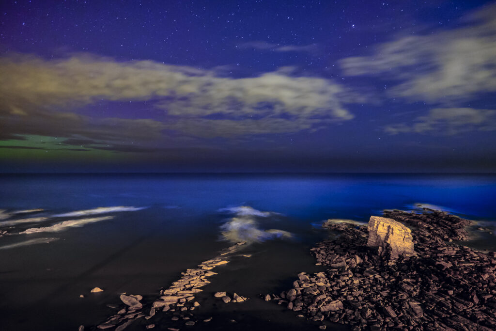 England, Northumberland, Seaton Sluice. Night time scene of Charlies Garden, a rock formation located in Collywell Bay, Seaton Sluice.