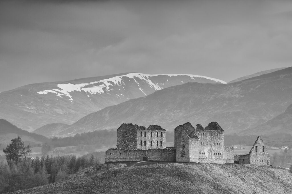 Scotland, Scottish Highlands, Cairngorms National Park. The Ruthven Barracks with the snow capped Monadhliath Mountains in the distance.