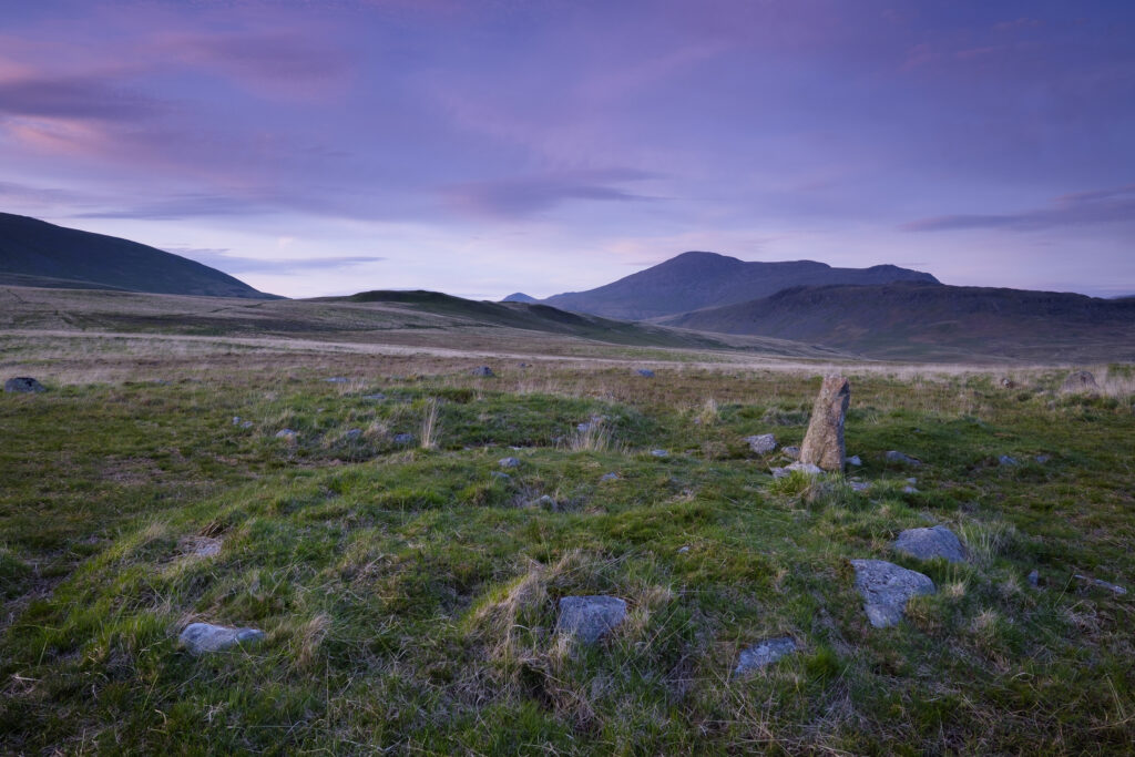 England, Cumbria, Lake District National Park. Stone circle forming part of Burnmoor Complex located on a fellside at the foothills of the mountains known as Scafell and Scafell Pike.