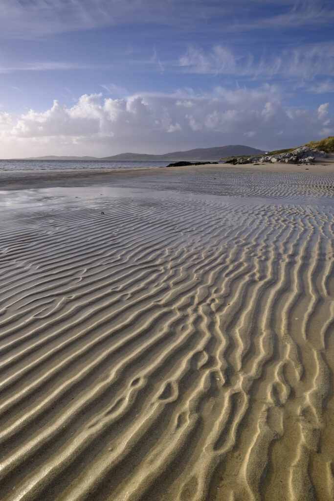 Scotland, The Isle of Harris, Lusketyre Bay. Late afternoon light illuminates the sand ripples of the Lusketyre Bay on the Luskentyre peninsula.