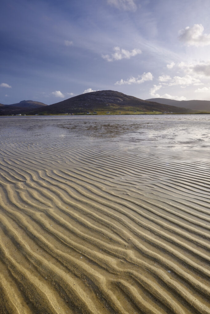 Scotland, The Isle of Harris, Seilebost. Late afternoon light illuminates the sand ripples of the Lusketyre Bay on the Luskentyre peninsula, looking towards Seilebost.