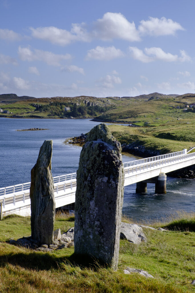 Scotland, Outer Hebrides, Bernera. Prehistoric Standing Stones above the road bridge spanning the Atlantic Ocean joining the island of Bernera with the Isle Of Lewis.